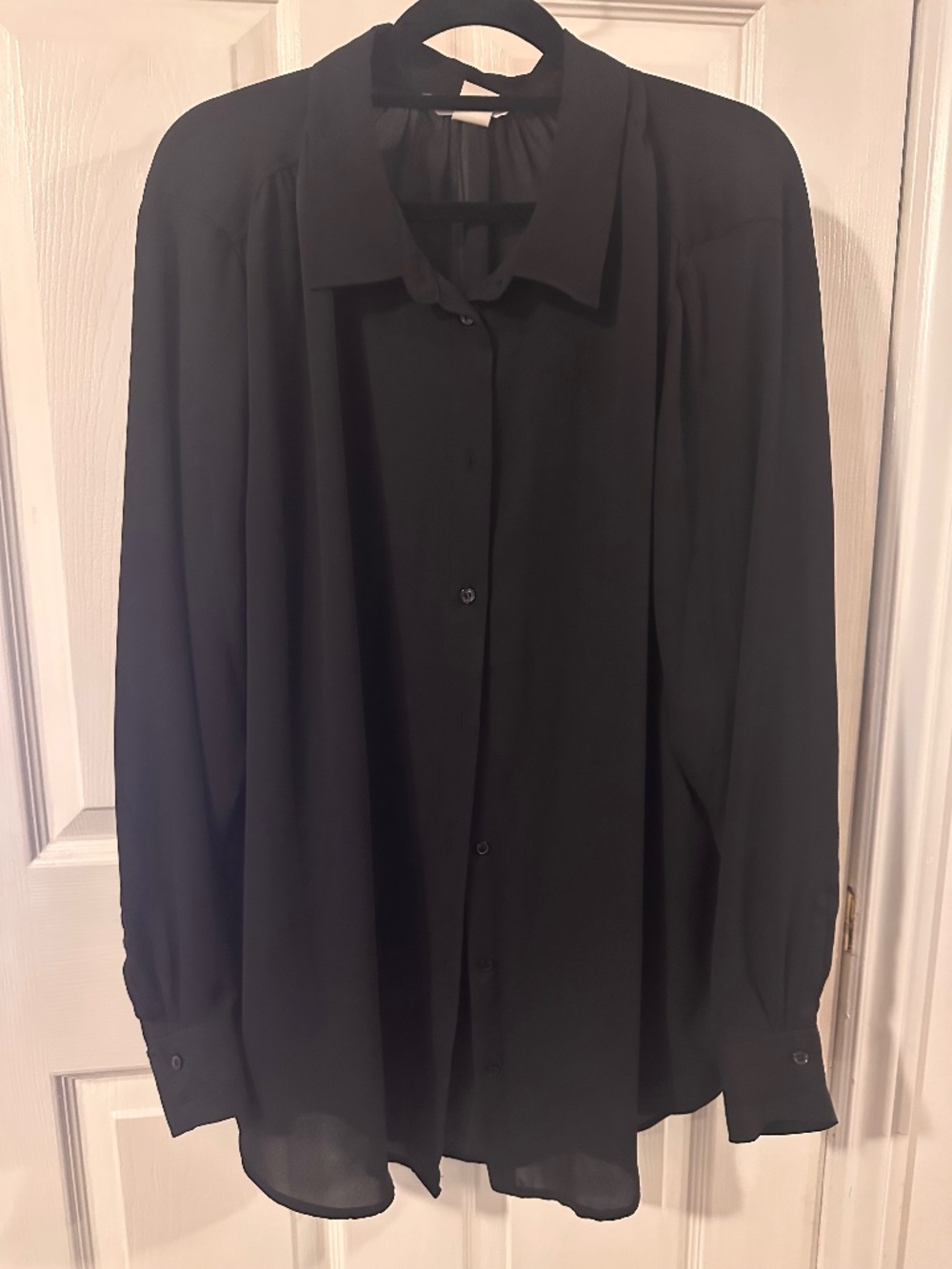 Black semi-sheer oversized blouse